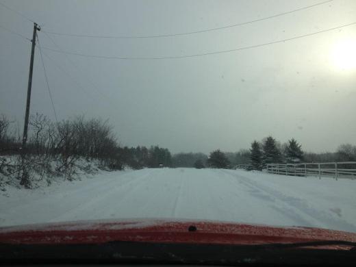 Hilly unpaved and unplowed road in Swisher, Iowa