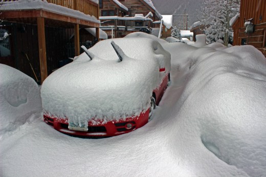 The 2 door convertible covered in a foot of snow