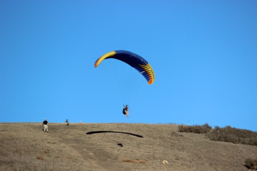 Stepping into the foot rest and harness